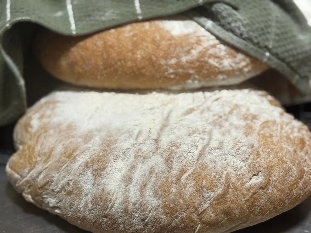 Freshly baked loaves dusted with flour