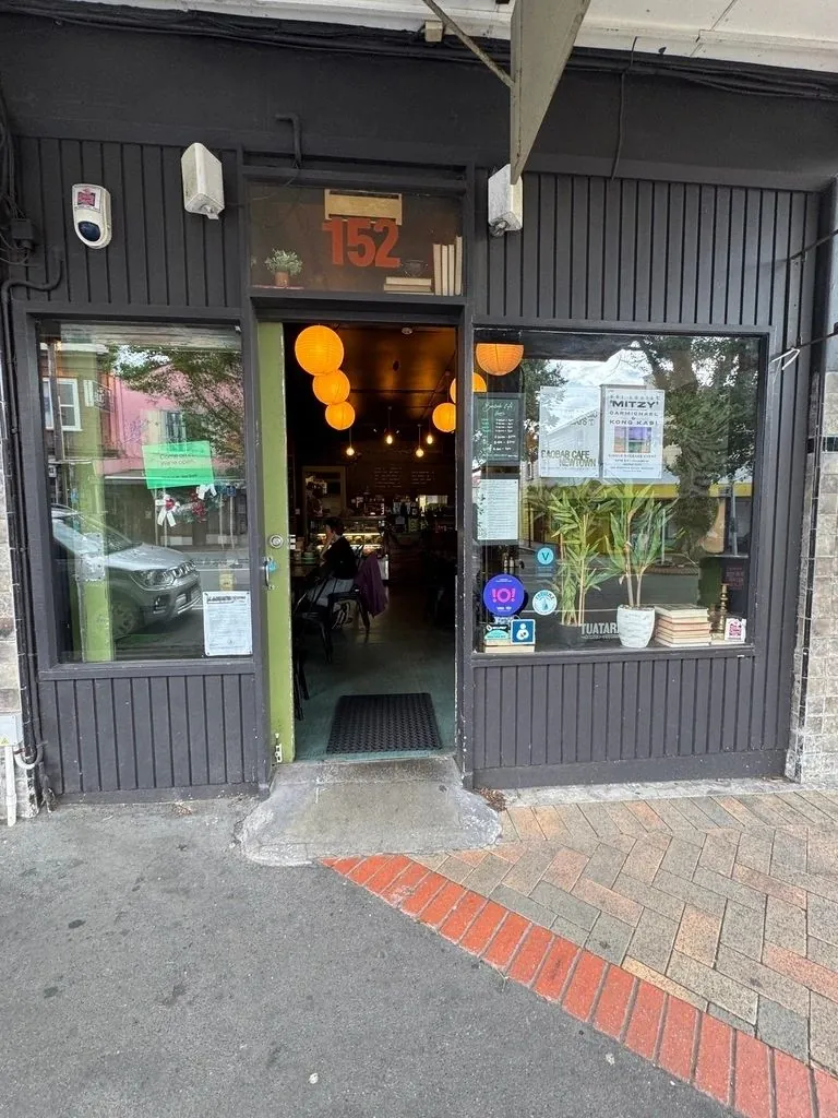 Baobab Café shopfront on Riddiford Street with glowing lanterns